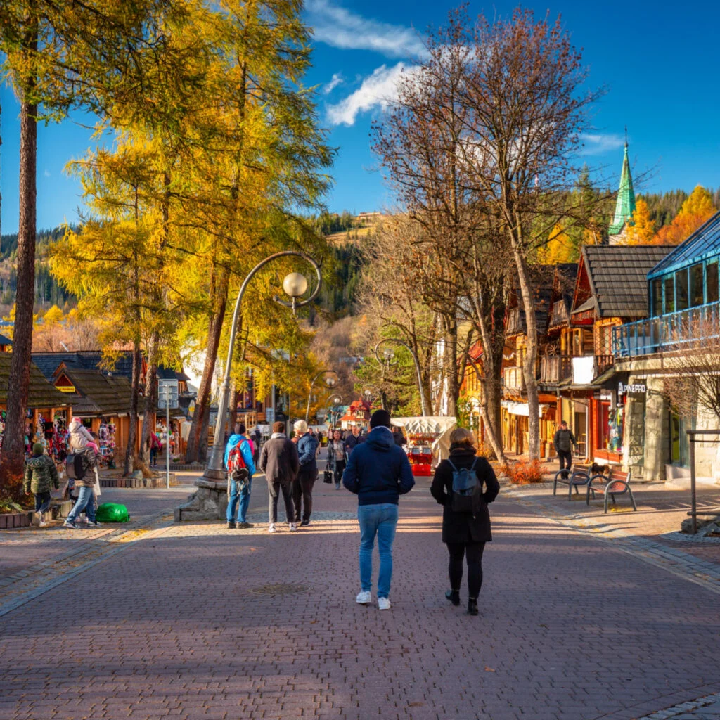Zakopane People on the main Krupowki street in Zakopane at autumn. Krupowki street is the main shopping and restaurant area in Zakopane, Poland.