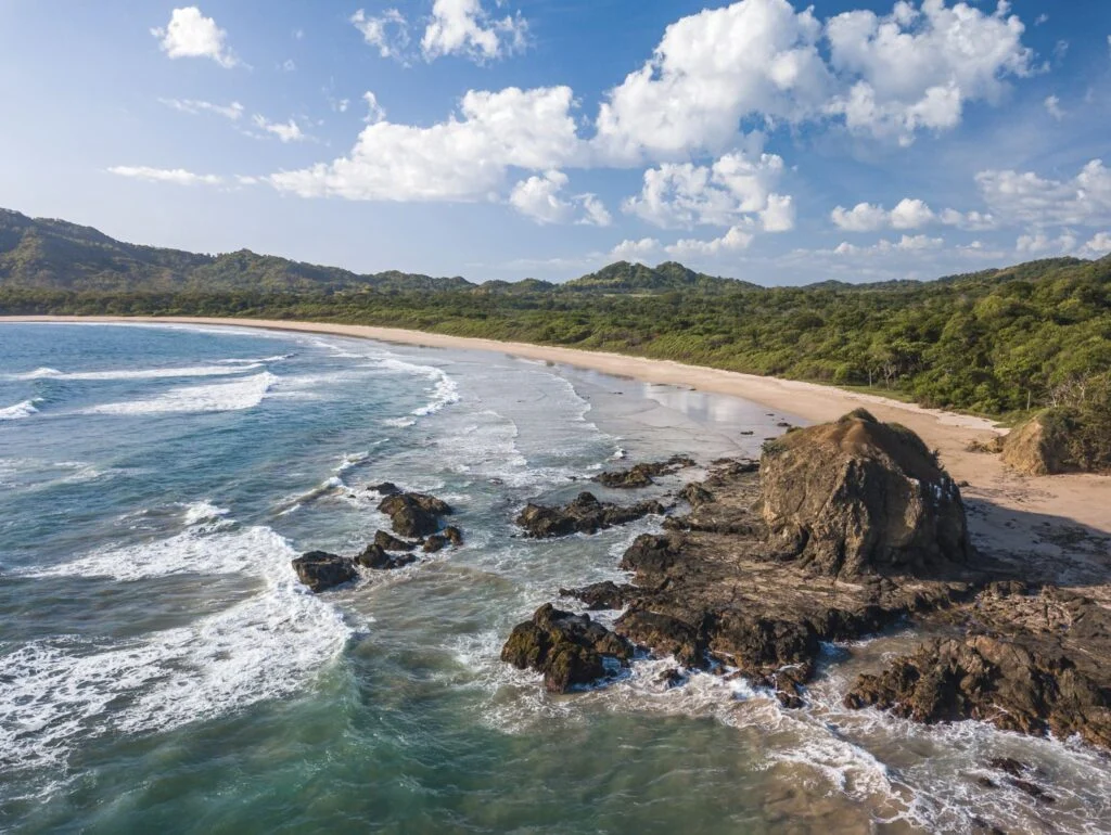 Playa Grande, Guanacaste, Costa-Rica - Aerial Drone shot of large Tropical Beach with big Rocks